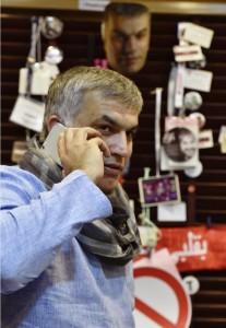 Bahrain's Human Rights Activist, Rajab, takes a call in his home office a day before being sentenced to six month in jail over remarks critical of the state, in Budaiya west of Manama