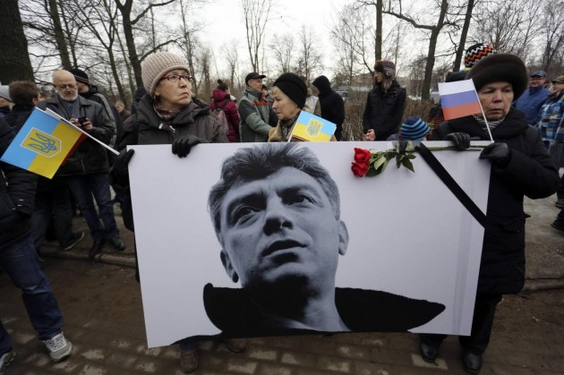 People attend a march to commemorate Kremlin critic Nemtsov in central St. Petersburg