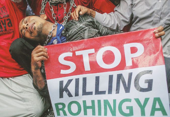 Malaysian activists and Myanmar ethnic Rohingya Muslims protest in front of the Myanmar Embassy in Kuala Lumpur
