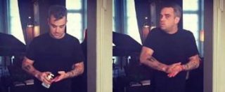 Copertina di Robbie Williams, alle polemiche sul disinfettante per le mani risponde con un video ironico