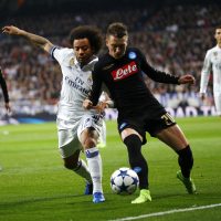 Real Madrid’s Brazilian defender Marcelo Vieria (L) vies for the ball with Napoli’s Polish midfielder Piotr Zielinski during their UEFA Champions League round of 16 match at Santiago Bernabeu stadium in Madrid, Spain, 15 February 2017. EFE/J.P. Gandul