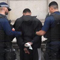 A man is held by police in Westminster after an arrest was made on Whitehall in central London, Britain, April 27, 2017. REUTERS/Toby Melville