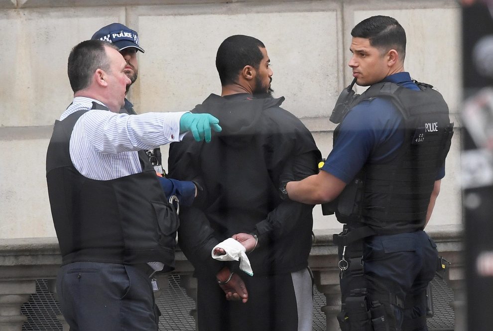 A man is held by police in Westminster after an arrest was made on Whitehall in central London, Britain, April 27, 2017. REUTERS/Toby Melville