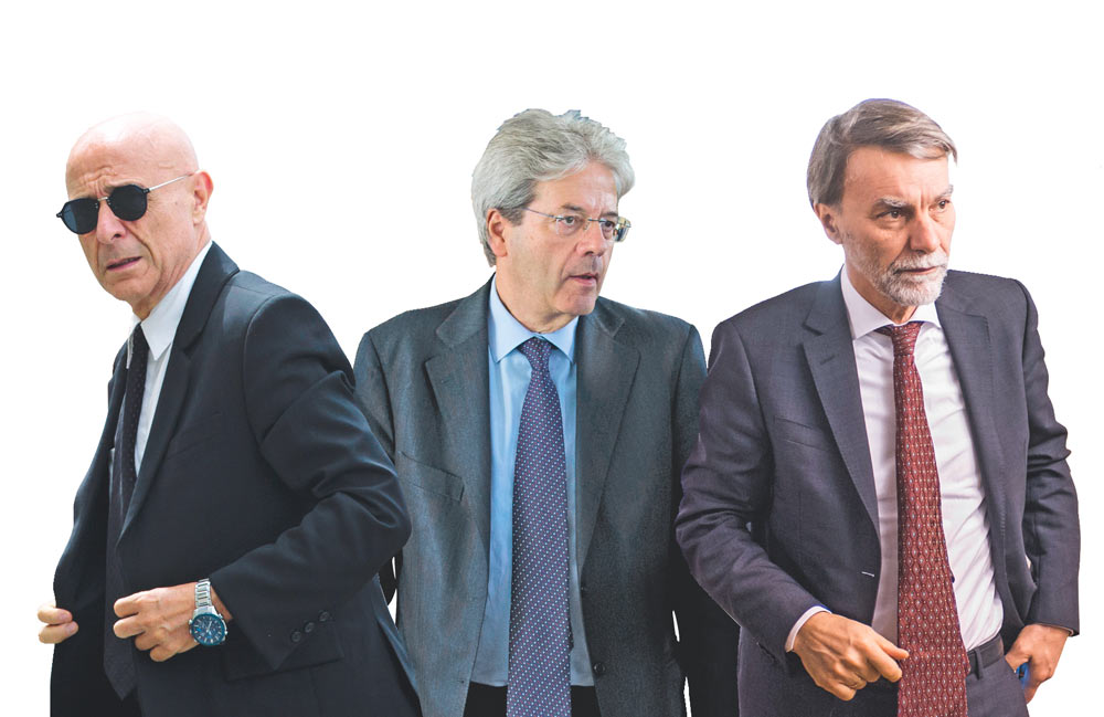 Contrasti - I ministri Marco Minniti e Graziano Delrio; al centro, il premier Paolo Gentiloni - Ansa L’ennesimo dietrofront: Ius soli torna a dicembre