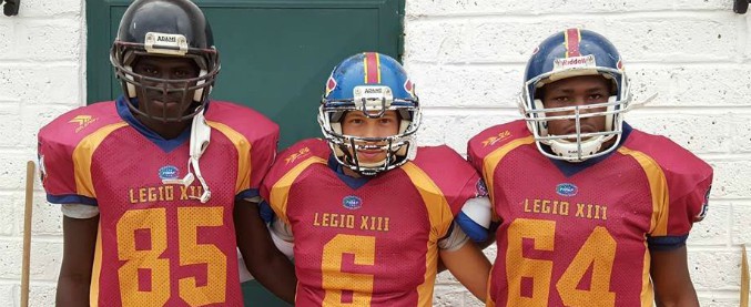 Copertina di Dal barcone nel Mediterraneo alla squadra di football americano. “Anche così integriamo chi viene dall’inferno”