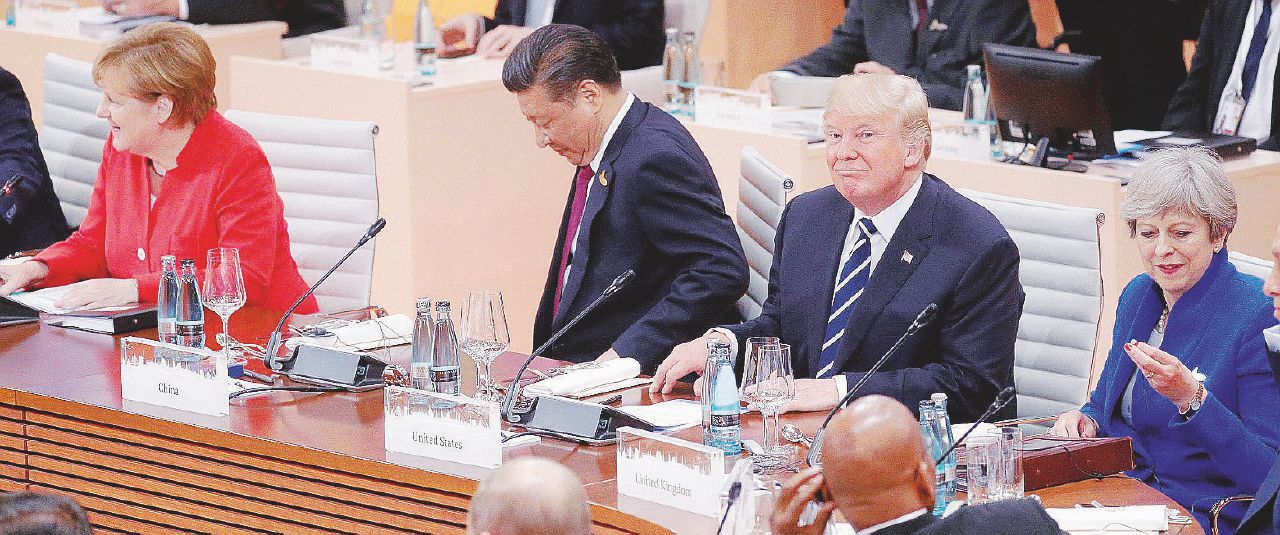 Al G20 di Amburgo - Donald Trump durante la prima sessione (luglio 2017) con Angela Merkel, Xi Jinping e Theresa May - Ansa Fra annunci e realtà tutti i dazi di Trump in guerra col mondo