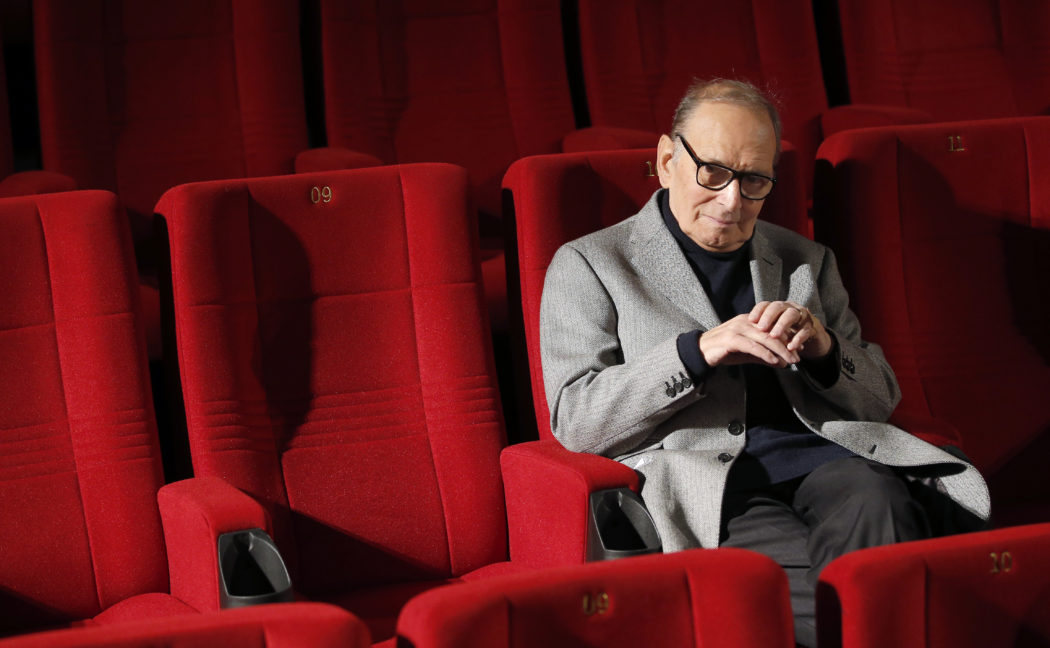 FILE – In this Dec. 6, 2013 file photo, Italian composer Ennio Morricone poses during a photo call to promote his German 2014 concerts, in Berlin, Germany. Morricone, who created the coyote-howl theme for the iconic Spaghetti Western “The Good, the Bad and the Ugly” and the soundtracks such classic Hollywood gangster movies as “The Untouchables,” died Monday, July 6, 2020 in a Rome hospital at the age of 91. (AP Photo/Michael Sohn, file)