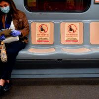 In vista della Fase 2, le aziende di trasporto pubblico preparano i mezzi con adesivi e alert per i passeggeri affinché rispettino le distanze (LaPresse/Claudio Furlan)