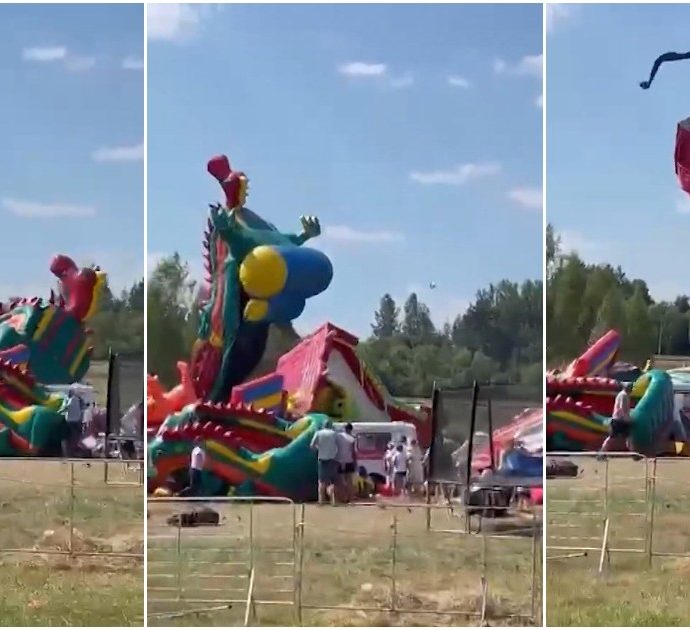 La folata di vento sorprende i bambini al parco dei gonfiabili: ne solleva uno a 9 metri da terra – Video