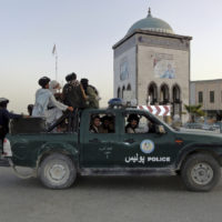 Taliban fighters patrol inside the city of Kandahar, southwest Afghanistan, Sunday, Aug. 15, 2021. (AP Photo/Sidiqullah Khan)