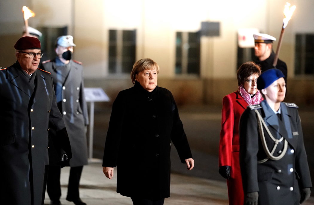 epa09617257 German Chancellor Angela Merkel arrives during the military grand tattoo in her honor at the defense ministry in Berlin, Germany, 02 December 2021. Acting German Chancellor Angela Merkel receives on 02 December 2021, on the occasion of her farewell, a Grand Tattoo of the German Federal Armed Forces (Bundeswehr).  EPA/FRIEDEMANN VOGEL
