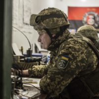 A Ukrainian officer works in Ukraine’s Army headquarters in the village of Novoluhanske, Luhansk region, Ukraine, Saturday, Feb. 19, 2022. Separatist leaders in eastern Ukraine have ordered a full military mobilization amid growing fears in the West that Russia is planning to invade the neighboring country. The announcement on Saturday came amid a spike in violence along the line of contact between Ukrainian forces and the pro-Russia rebels in recent days. (AP Photo/Oleksandr Ratushniak)