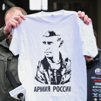 epa09809948 Mayor of Przemysl Wojciech Bakun shows a t-shirt with putin’s Portrait and slogan ‘Russian Army’ during a press conference with Former Deputy Prime Minister of Italy, and Lega leader Matteo Salvini in front of the Main Railway Station in Przemysl, Poland 08 March 2022. Mayor Bakun unsuccessfully tried to hand Matteo Salvini a T-shirt with an image of Vladimir Putin, similar to one Salvini was posing with at Kremlin during a visit to Moscow and asked the italian senator to wear it during a visit to refugees reception center close to the border with Ukraine.  EPA/DAREK DELMANOWICZ POLAND OUT