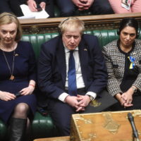 epa09810698 A handout photograph released by the UK Parliament shows (L-R) Britain’s Foreign Secretary Liz Truss, Prime Minister Boris Johnson and Home Secretary Priti Patel listening to Ukrainian President Zelensky addressing via video-link the House of Commons Chamber about the situation in Ukraine, in London, Britain, 08 March 2022.  EPA/UK PARLIAMENT/JESSICA TAYLOR HANDOUT — MANDATORY CREDIT: UK PARLIAMENT/JESSICA TAYLOR — HANDOUT EDITORIAL USE ONLY/NO SALES