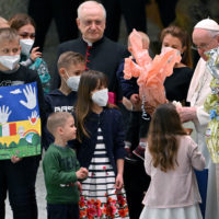 Pope Francis (3-R) presents Easter eggs as he meets with Ukrainian children during the weekly general audience in the Paul VI Audience Hall, in Vatican City, 06 April 2022. The pontiff lamented the ‘massacre of Bucha’, in the Kyiv suburb where dozens of bodies in civilian clothing have been found, and renewed his calls for an end to the war in Ukraine.  ANSA/ETTORE FERRARI