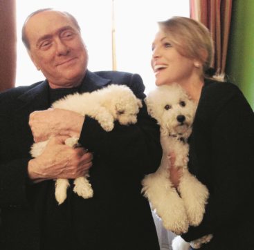 La candidata di B.  e il boss con la Ferrari