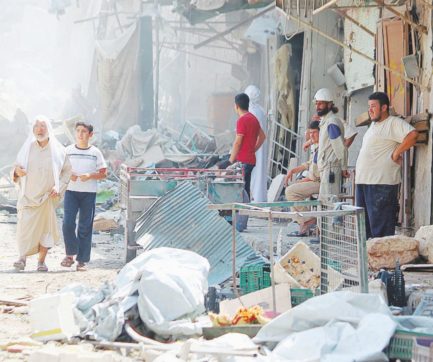 Copertina di Caccia di Assad precipita  sul mercato e fa una strage: 31 morti e 60 feriti