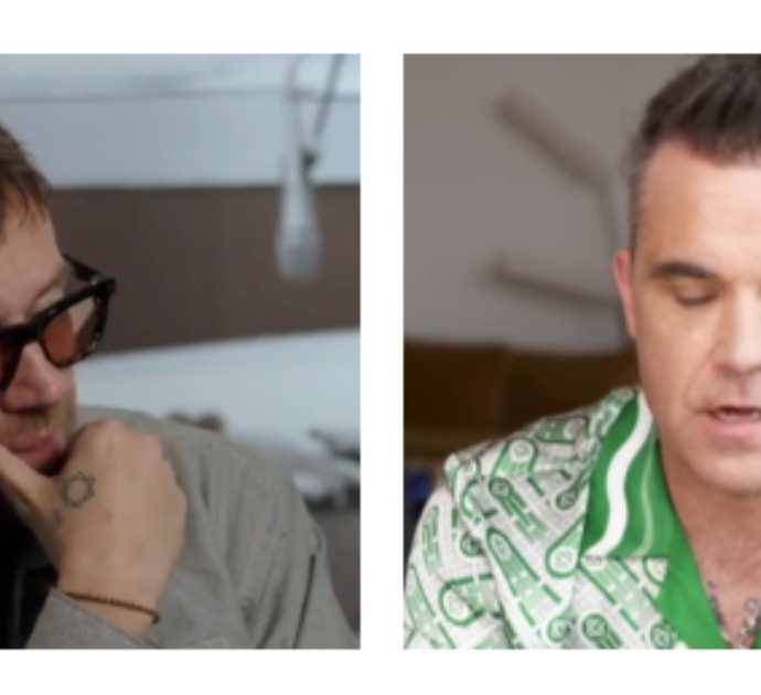 Robbie Williams scatenato contro Damon Albarn: “Penso che dicendo queste cose stia masturbandosi”. Ecco cosa è accaduto