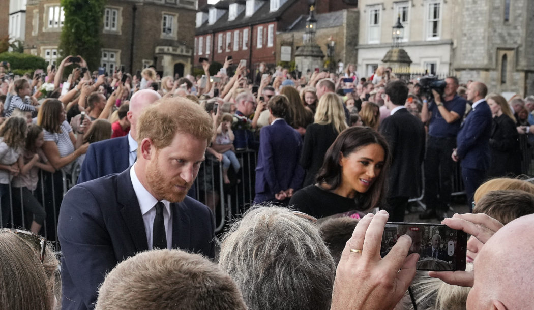 Britain’s Prince Harry and Meghan, Duchess of Sussex meet people after viewing the floral tributes for the late Queen Elizabeth II outside Windsor Castle, in Windsor, England, Saturday, Sept. 10, 2022. (AP Photo/Martin Meissner)