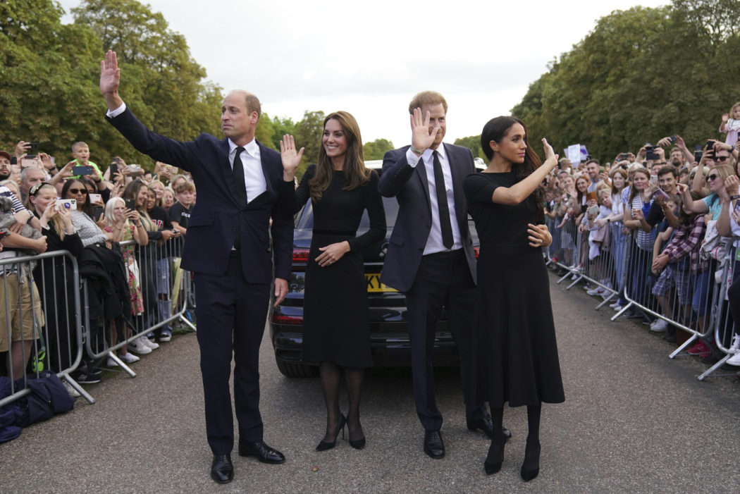 From left, Britain’s Prince William, Prince of Wales, Kate, Princess of Wales, Prince Harry and Meghan, Duchess of Sussex wave to members of the public at Windsor Castle, following the death of Queen Elizabeth II on Thursday, in Windsor, England, Saturday, Sept. 10, 2022. (Kirsty O’Connor/Pool Photo via AP)