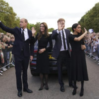 From left, Britain’s Prince William, Prince of Wales, Kate, Princess of Wales, Prince Harry and Meghan, Duchess of Sussex wave to members of the public at Windsor Castle, following the death of Queen Elizabeth II on Thursday, in Windsor, England, Saturday, Sept. 10, 2022. (Kirsty O’Connor/Pool Photo via AP)
