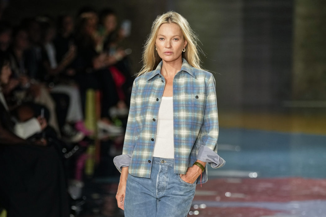 Kate Moss wears a creation as part of the Bottega Veneta women’s Spring Summer 2023 collection presented in Milan, Italy, Saturday, Sept. 24, 2022. (AP Photo/Antonio Calanni)