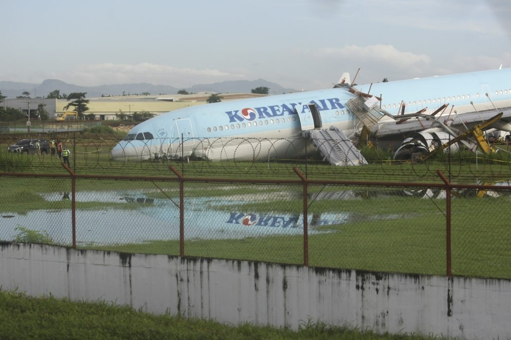 A damaged Korean Air plane sits after it overshot the runway at the Mactan-Cebu International Airport in Cebu, central Philippines early Monday Oct. 24, 2022. The Korean Air plane overshot the runway while landing in bad weather in the central Philippines late Sunday, but authorities said all 173 people on board were safe. (AP Photo/Juan Carlo De Vela)