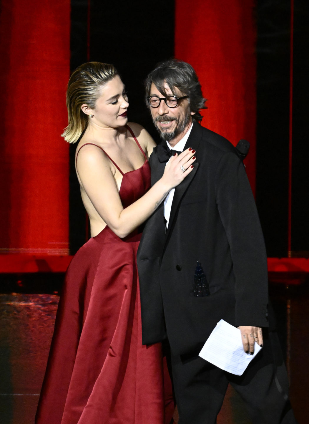 LONDON, ENGLAND – DECEMBER 05: Florence Pugh presents the Designer Of The Year award to Pierpaolo Piccioli for Valentino on stage during The Fashion Awards 2022 at the Royal Albert Hall on December 05, 2022 in London, England. (Photo by Gareth Cattermole/BFC/Getty Images for BFC)