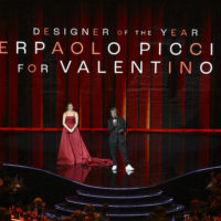 LONDON, ENGLAND – DECEMBER 05: Florence Pugh presents the Designer Of The Year award to Pierpaolo Piccioli for Valentino on stage during The Fashion Awards 2022 at the Royal Albert Hall on December 05, 2022 in London, England. (Photo by Gareth Cattermole/BFC/Getty Images for BFC)