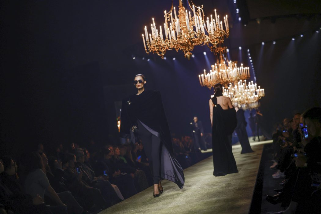 Models wear creations as part of the Saint Laurent Fall/Winter 2023-2024 ready-to-wear collection presented Tuesday, Feb. 28, 2023 in Paris. (Vianney Le Caer/Invision/AP)