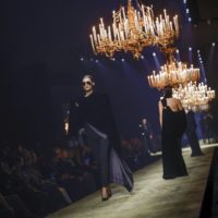Models wear creations as part of the Saint Laurent Fall/Winter 2023-2024 ready-to-wear collection presented Tuesday, Feb. 28, 2023 in Paris. (Vianney Le Caer/Invision/AP)