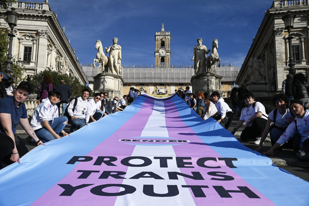 Demonstrators unroll a banner on the steps of the Campidoglio during the Trans Day of Visibility, Rome, Italy, 1 April 2023. ANSA/RICCARDO ANTIMIANI
