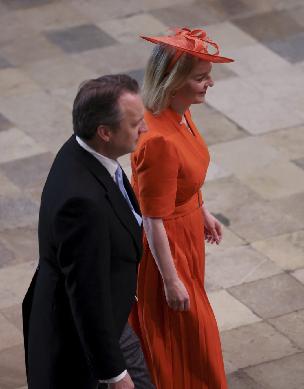 Former Prime Minister Liz Truss, right, arrives to attend Britain’s King Charles III and Queen Consort Camilla’s coronation ceremony, at Westminster Abbey, in London, Saturday, May 6, 2023. (Phil Noble/Pool Photo via AP)