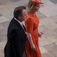 Former Prime Minister Liz Truss, right, arrives to attend Britain’s King Charles III and Queen Consort Camilla’s coronation ceremony, at Westminster Abbey, in London, Saturday, May 6, 2023. (Phil Noble/Pool Photo via AP)