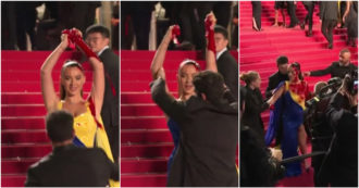 Copertina di Si cosparge di sangue sul red carpet di Cannes: la protesta con l’abito coi colori dell’Ucraina – Video