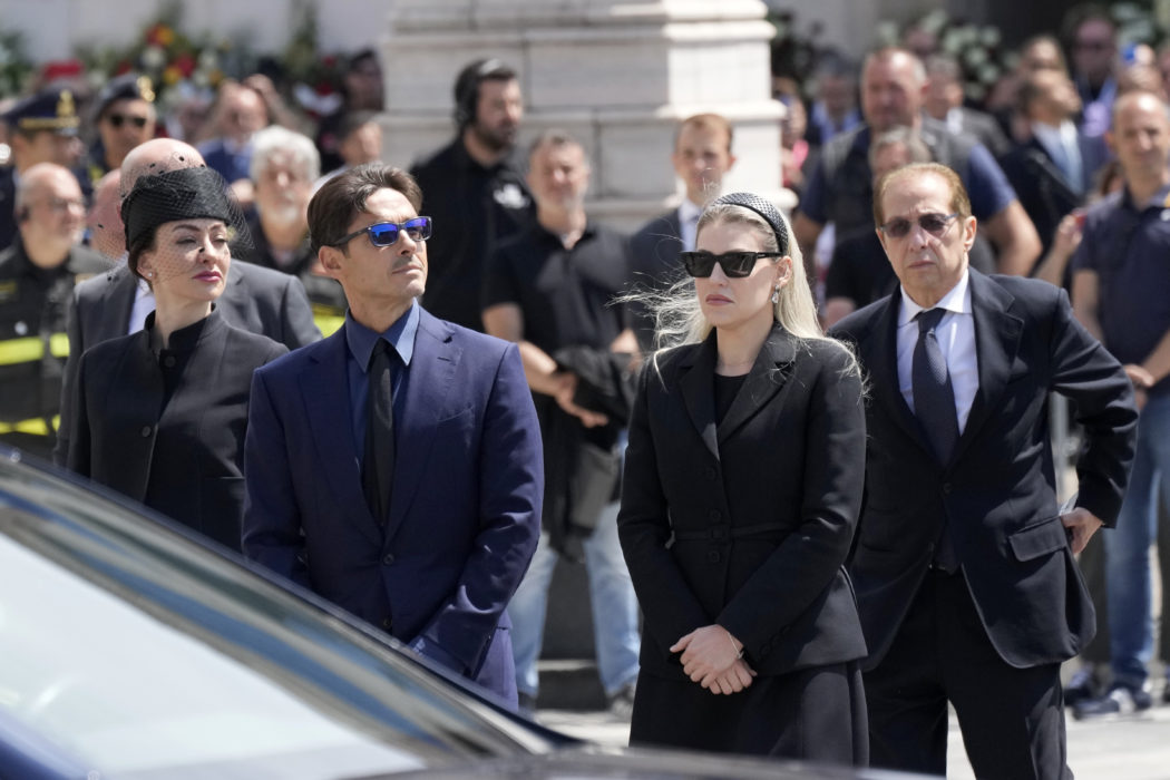 Paolo Berlusconi, brother of former Italian premier Silvio Berlusconi, right, and Silvio Berlusconi’s children Barbara, second from right, Pier Silvio, and Eleonora, left, wait for their father’s hearse to arrive for a state funeral, at Milan’s Duomo Gothic Cathedral, Italy, Wednesday, June 14, 2023. Berlusconi died at the age of 86 on Monday in a Milan hospital where he was being treated for chronic leukemia. (AP Photo/Antonio Calanni)