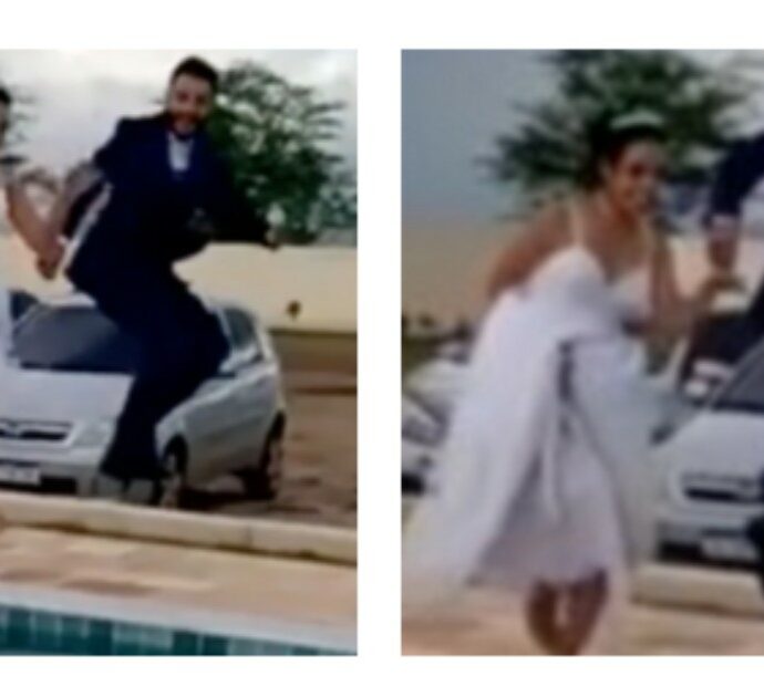 Sposi decidono di buttarsi in piscina vestiti con gli abiti nuziali, prendono la ricorsa ma uno solo salta: “Matrimonio finito” – Il video