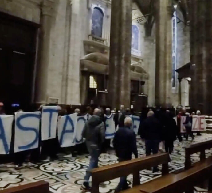 “Basta guerre, basta ingiustizie”, srotolato uno striscione nella navata centrale del Duomo di Milano: il video del blitz