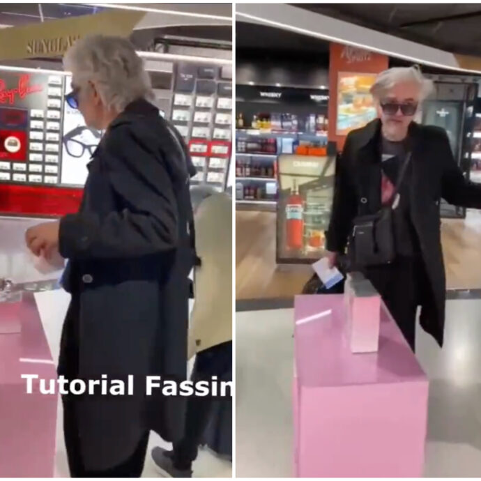 Morgan scatenato in aeroporto passa in profumeria e lancia sui social il “Tutorial Fassino” – IL VIDEO