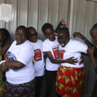 Relatives try to comfort a woman crying after viewing the body of Ugandan Olympic athlete Rebecca Cheptegei at Moi Teaching and Referral Hospital morgue in the western city of Eldoret, in Rift Valley, Kenya Friday, Sept. 13, 2024. (AP Photo/Andrew Kasuku)