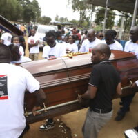 Relatives and friends carry the casket of Ugandan Olympic athlete Rebecca Cheptegei outside Moi Teaching and Referral Hospital morgue in the western city of Eldoret, in Rift Valley, Kenya Friday, Sept. 13, 2024. (AP Photo/Andrew Kasuku)