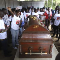 Relatives and friends view the body of Ugandan Olympic athlete Rebecca Cheptegei at Moi Teaching and Referral Hospital morgue in the western city of Eldoret, in Rift Valley, Kenya Friday, Sept. 13, 2024. (AP Photo/Andrew Kasuku)