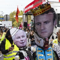 epa11617512 Protesters hold an placard of  the Prime Minister Michel Barnier and French President Emmanuel Macron during a protest, in Paris, France, 21 September 2024. Newly appointed French Prime Minister Michel Barnier communicated the list of names of his proposed government to the French President Emmanuel Macron on 20 September. The approval of this list is expected to be in the next few days. The French left parties coalition, Nouveau Front Populaire (NFP), which had arrived ahead in the last legislative elections but fell short of a full majority, called for rallies on 21 September, as they say that their win was not taken in consideration in the formation of the new cabinet.  EPA/ANDRE PAIN