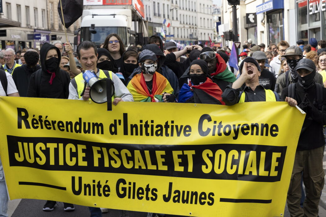 epa11617510 Protesters demonstrate against the French President Emmanuel Macron and the Prime Minister Michel Barnier, a banner reads in French More Tax and Social Justice in Paris, France, 21 September 2024. Newly appointed French Prime Minister Michel Barnier communicated the list of names of his proposed government to the French President Emmanuel Macron on 20 September. The approval of this list is expected to be in the next few days. The French left parties coalition, Nouveau Front Populaire (NFP), which had arrived ahead in the last legislative elections but fell short of a full majority, called for rallies on 21 September, as they say that their win was not taken in consideration in the formation of the new cabinet.  EPA/ANDRE PAIN