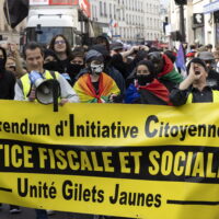 epa11617510 Protesters demonstrate against the French President Emmanuel Macron and the Prime Minister Michel Barnier, a banner reads in French More Tax and Social Justice in Paris, France, 21 September 2024. Newly appointed French Prime Minister Michel Barnier communicated the list of names of his proposed government to the French President Emmanuel Macron on 20 September. The approval of this list is expected to be in the next few days. The French left parties coalition, Nouveau Front Populaire (NFP), which had arrived ahead in the last legislative elections but fell short of a full majority, called for rallies on 21 September, as they say that their win was not taken in consideration in the formation of the new cabinet.  EPA/ANDRE PAIN