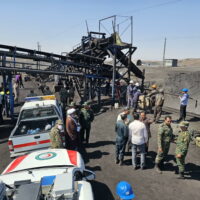 epa11618515 A handout photo made available by the Iranian Red Crescent Society (IRCS) shows Iranian rescue and security forces gathered around a coal mine in Tabas, Khorasan province in southeastern Iran, 22 September 2024. Iranian state media, citing the governor of South Khorasan province, reported that a methane leak at a coal mine in Tabas, eastern Iran, caused an explosion that resulted in at least 30 workers dying, 17 injured, and others missing.  EPA/IRANIAN RED CRESCENT SOCIETY / HANDOUT HANDOUT EDITORIAL USE ONLY/NO SALES