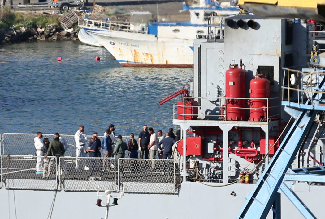 epa11661888 A group of migrants intercepted in Italian waters arrive aboard an Italian navy boat at Shengjin, Albania, 16 October 2024. Italy has begun sending migrants rescued in the Mediterranean to detention centers in Albania, where their asylum claims will be processed. The plan, finalized in February 2024, allows Italy to transfer up to 36,000 asylum seekers to Albania annually, with the goal of deterring migrants from attempting to reach Italy. While the Italian government and some EU leaders support the program, human rights groups criticize it for potentially putting migrants at risk and exposing them to rights violations.  EPA/MALTON DIBRA