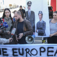 Activists, holding pictures of the Italian and Albanian premiers dressed as police officers, protest at the entrance of the port of Shengjin, northwestern Albania Wednesday, Oct. 16, 2024, following the arrival of an Italian navy ship carrying the first group of migrants who were intercepted in international waters. (AP Photo/Vlasov Sulaj) 


associated Press / LaPresse
Only italy and Spain