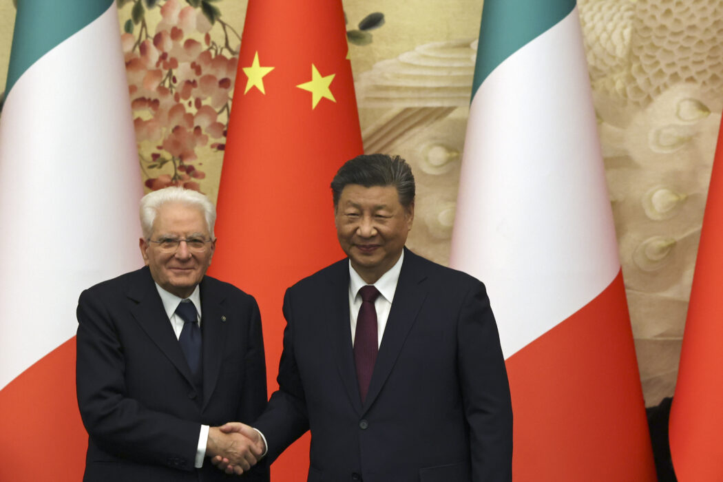 Chinese President Xi Jinping, right, and Italian President Sergio Mattarella shake hands at a signing ceremony at the Great Hall of the People in Beijing, Friday, Nov. 8, 2024. (Florence Lo/Pool Photo via AP)