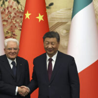 Chinese President Xi Jinping, right, and Italian President Sergio Mattarella shake hands at a signing ceremony at the Great Hall of the People in Beijing, Friday, Nov. 8, 2024. (Florence Lo/Pool Photo via AP)